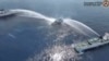 In this image made from video provided by the Philippine Coast Guard, a Philippine Coast Guard vessel is blasted by Chinese coast guard water cannons as it approached waters near Scarborough Shoal, locally known as Bajo De Masinloc, in the South China Sea on April 30, 2024.