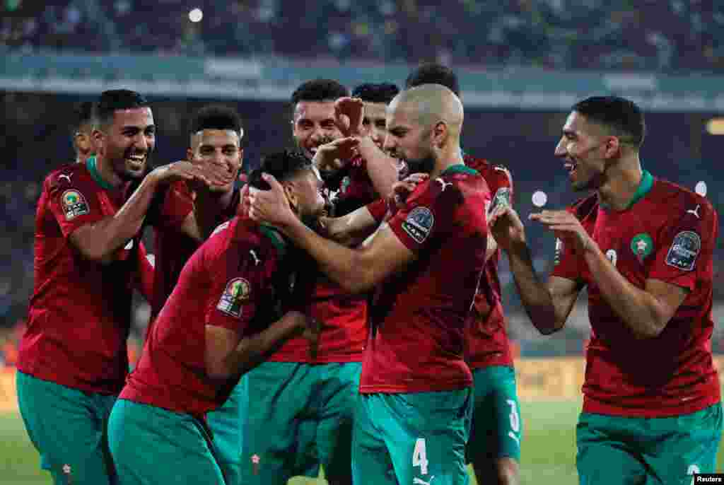 Morocco&#39;s Sofiane Boufal celebrates scoring their first goal against Gabon with teammates ; Cameroon, Jan. 18, 2022.