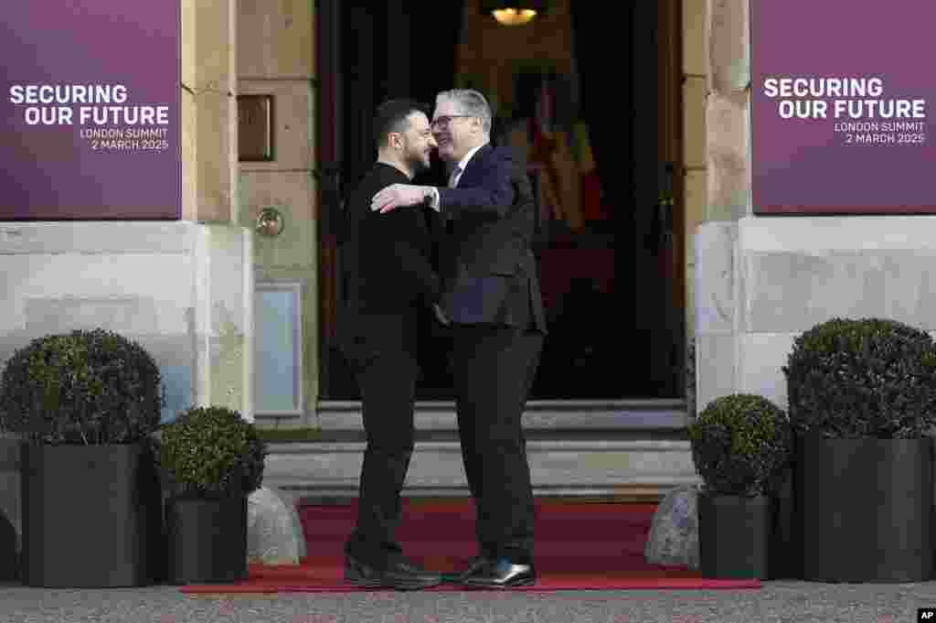 Britain&#39;s Prime Minister Keir Starmer, right, welcomes Ukrainian President Volodymyr Zelenskyy to the European leaders&#39; summit to discuss Ukraine, at Lancaster House, London.