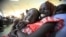South Sudanese waiting to be flown back to their country sit at Khartoum Airport May 14, 2012. 