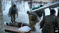A wounded Ukrainian soldier is treated in Avdiivka, Ukraine, Jan. 31, 2017.