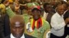 FILE: President Robert Mugabe greets party supporters upon his arrival at the 9th Zanu pf National Peoples Conference in Goromonzi, 45 km east of Harare, Zimbabwe Friday, Dec, 15, 2006. (AP Photo/Tsvangirayi Mukwazhi)