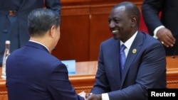 Chinese President Xi Jinping and Kenyan President William Ruto greet each other at the opening ceremony of the ninth Forum on China-Africa Cooperation Summit at the Great Hall of the People in Beijing on Sept. 5, 2024.