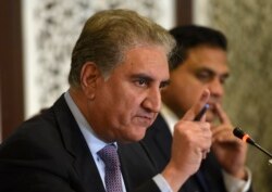 FILE - Pakistani Foreign Minister Shah Mahmood Qureshi addresses a news conference in Islamabad, Pakistan, Aug. 8, 2019.