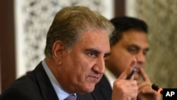 FILE - Pakistani Foreign Minister Shah Mahmood Qureshi addresses a news conference in Islamabad, Pakistan, Aug. 8, 2019. 