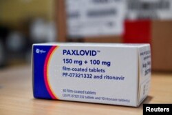 FILE - Coronavirus disease (COVID-19) treatment pill Paxlovid is seen in a box, at Misericordia hospital in Grosseto, Italy, February 8, 2022. (REUTERS/Jennifer Lorenzini)