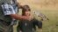 A child interacts with a bird at the bird sanctuary, Kuimba Shiri, near Harare, Zimbabwe, Wednesday, June, 17, 2020. Kuimba Shiri, Zimbabwe's only bird park, has survived tumultuous times, including…