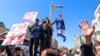 Demonstrators hang an effigy of the Israeli prime minister during the funeral for seven Islamic Revolutionary Guard Corps members killed in a strike in Syria, which Iran blamed on Israel, in Tehran on April 5, 2024.