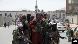 Taliban fighters patrol in Kabul, Afghanistan, Aug. 19, 2021, as senior members of the Haqqani Network, a group with a long-standing association with al-Qaida, is being put in charge of security in the Afghan capital.