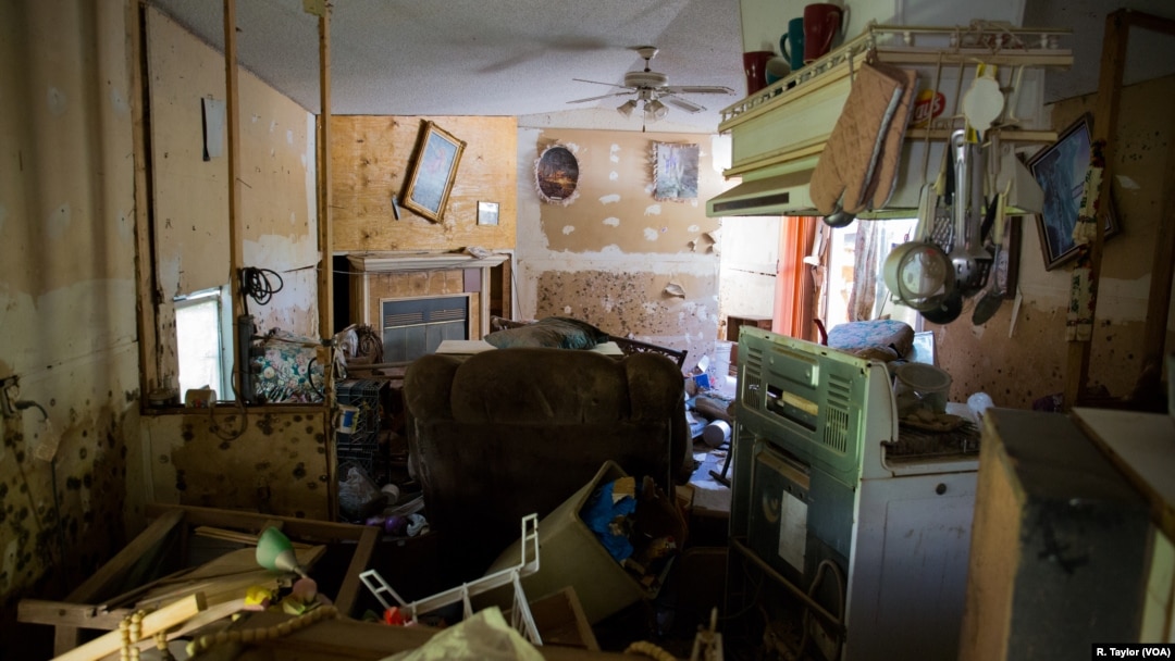 The trailer where Valerie Van Note once lived is uninhabitable since Hurricane Harvey hit Houston two months ago. Van Note how sleeps in a friend's sports utility vehicle, which is parked next to the trailer.