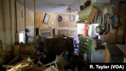 The trailer where Valerie Van Note once lived is uninhabitable since Hurricane Harvey hit Houston two months ago. Van Note how sleeps in a friend's sports utility vehicle, which is parked next to the trailer.