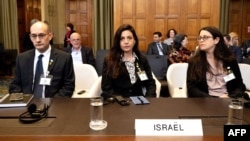 Israeli Deputy Attorney General Gilad Noam, legal adviser to Israel's Ministry of Foreign Affairs Tamar Kaplan Tourgman and legal adviser at the Israeli Embassy to the Netherlands Avgail Frisch Ben Avraham wait at the International Court of Justice in The Hague, May 16, 2024.