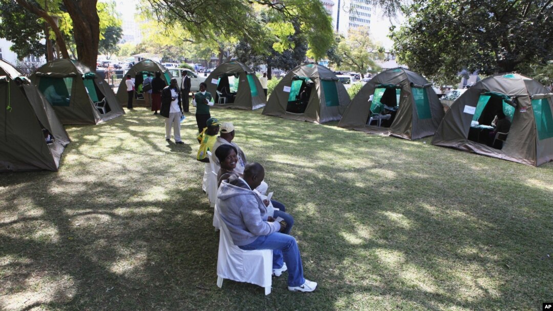 Members of the public wait to be tested for HIV and Aids in Harare, Zimbabwe, June, 22, 2012.