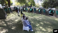 Members of the public wait to be tested for HIV and Aids in Harare, Zimbabwe, June, 22, 2012.