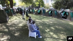 Members of the public wait to be tested for HIV and Aids in Harare, Zimbabwe, June, 22, 2012.