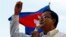 In this file photo taken on Dec. 22, 2013, Cambodian opposition leader Sam Rainsy of the Cambodia National Rescue Party delivers a speech before his party supporters during a rally in Phnom Penh, Cambodia.