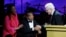 Honoree Steve Martin (R) accepts his award from Muhammed and Lonnie Ali at the Muhammad Ali Celebrity Fight Night Awards XIX in Phoenix, Arizona March 23, 2013. The charity event is held in honor of Muhammad Ali's fight to find a cure for Parkinson's dise