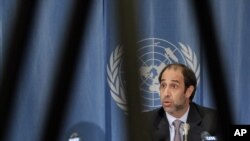 Tomas Ojea Quintana, United Nations Special Rapporteur on the situation of human rights in Myanmar is pictured through a television tripod during a news conference (file photo)