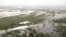 FILE - This image from video shows flooded fields on Gold Coast, Australia, Jan. 18, 2020. 