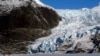 FILE - People walk near the Mendenhall Glacier on Feb. 9, 2025, in Juneau, Alaska. 