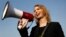 FILE - Chelsea Manning addresses participants at an anti-fracking rally in Baltimore, April 18, 2018. Chelsea Manning, who leaked classified documents, will not be allowed to enter Australia for a speaking tour scheduled to start Sunday.