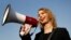 FILE - Chelsea Manning addresses participants at an anti-fracking rally in Baltimore, April 18, 2018. Chelsea Manning, who leaked classified documents, will not be allowed to enter Australia for a speaking tour scheduled to start Sunday.