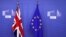 British and EU flags are seen before Britain's Prime Minister Theresa May meets with Commission President Jean-Claude Juncker to discuss draft agreements on Brexit, at the EC headquarters in Brussels, Belgium, Nov. 21, 2018. 