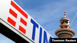 FILE - Telecom Italia's new logo is seen at the headquarters in the Rozzano neighborhood of Milan.