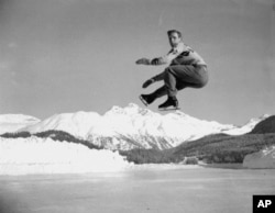 FILE - US fig  skater Dick Button executes a leap  during a signifier    league   astatine  St. Moritz, Switzerland, connected  Jan. 19, 1948, successful  mentation  for the Winter Olympics of 1948.