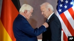 President Joe Biden receives Germany's Grand Cross special class of the Order of Merit by German President Frank-Walter Steinmeier at Bellevue Palace in Berlin, Germany, Oct. 18, 2024.