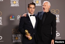 Director Martin McDonagh and Colin Farrell pose with their award for Best Motion Picture in a Musical or Comedy for "The Banshees of Inisherin" at the 80th Annual Golden Globe Awards in Beverly Hills, California, Jan. 10, 2023.