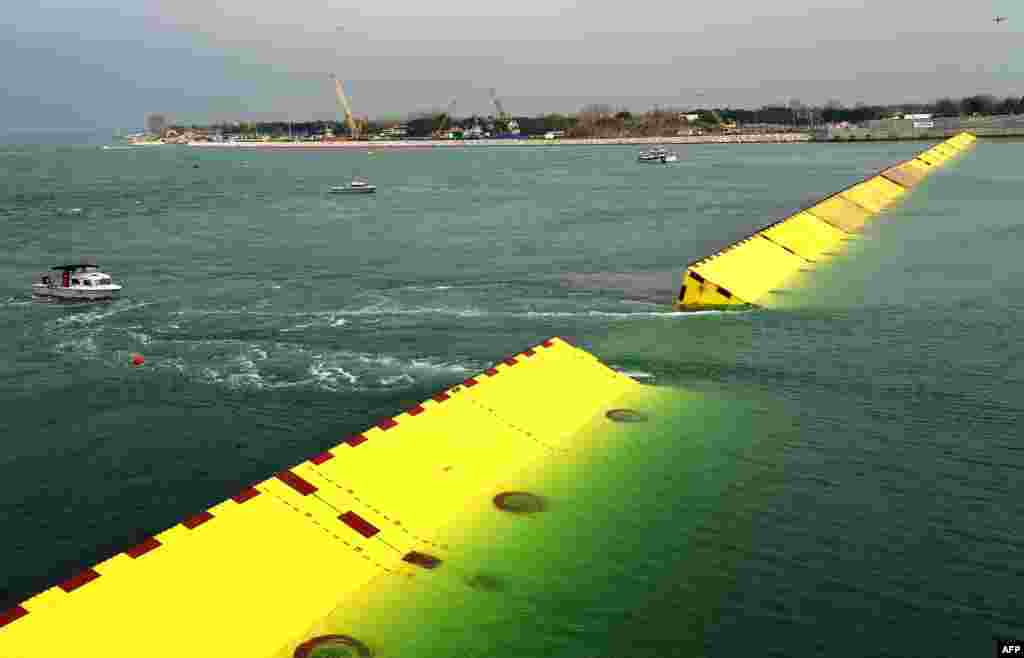 Gates emerge from the water during tests of an experimental project intended to protect Venice from floods.