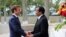 Cameroon's President Paul Biya welcomes his French counterpart Emmanuel Macron at the presidential palace in Yaounde, Cameroon, July 26, 2022