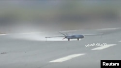 FILE - A 'Sammad 3' drone takes off from an unidentified location in Yemen in this still image taken from video released by Houthi-run Al-Masirah TV, July 9, 2019.