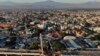 An aerial view of subway cars dangle at an angle from a collapsed elevated section of the metro, in Mexico City, &nbsp;killing at least 23 people and injuring at least 79.