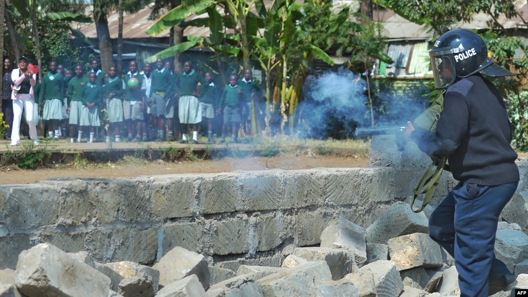 Police tear gas children from the Langata Road Primary School during a protest over a land dispute Jan. 19, 2015 in Nairobi.