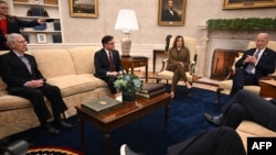 US President Joe Biden (R) and Vice President Kamala Harris (3rd L) meet with House Speaker Mike Johnson (2nd L) and Senate Minority Leader Mitch McConnell (L) in the Oval Office of the White House in Washington, DC on February 27, 2024.