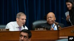 FILE - Rep. Jim Jordan, R-Ohio (L), the ranking member, makes a statement as House Oversight and Reform Committee Chairman Elijah Cummings, D-Md. (R), leads the vote to subpoena presidential counselor Kellyanne Conway, June 26, 2019. 
