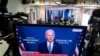 President-elect Joe Biden speaks about coronavirus as he appears on a television in the Brady Press Briefing Room of the White House in Washington, Nov. 9, 2020. 