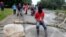 FILE - Indigenous people protest against the goverment, demanding land reform and increased state spending in rural areas, at the Panamerican highway in Mondomo, Cauca, Colombia, June 3, 2016.