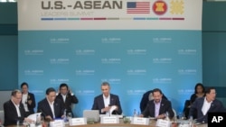 President Barack Obama, center, opens up his notebook before delivering remarks at the plenary session meeting of ASEAN, the 10-nation Association of Southeast Asian Nations, at the Annenberg Retreat at Sunnylands in Rancho Mirage, Calif., for Feb. 15, 2016. President Obama is hosting the ASEAN leaders, it is the first meeting of its kind on U.S. soil, as he looks to deepen ties with the region's fast-growing economies. Sitting with Obama are left to right, Philippine President Benigno Aquino III, Laos President Choummaly Sayasone, Brunei's Sultan Hassanal Bolkiah, Sec. of State John Kerry, National Security Adviser, Susan Rice and Cambodia's Prime Minister Hun Sen. (AP Photo/Pablo Martinez Monsivais)