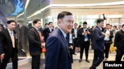 FILE - Former Thai Prime Minister Thaksin Shinawatra arrives ahead of the “Vision for Thailand” event in Bangkok, Thailand, Aug. 22, 2024. 