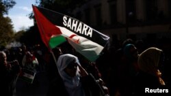 FILE - Protesters in Madrid, Spain, take part in a demonstration in support of Western Sahara's independence.