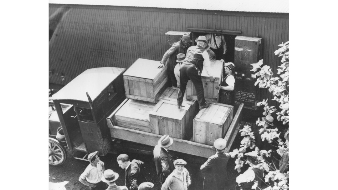 FILE - In this May 15, 1929, photo, authorities unload cases of whiskey crates labeled as green tomatoes from a refrigerator car in Washington, D.C.