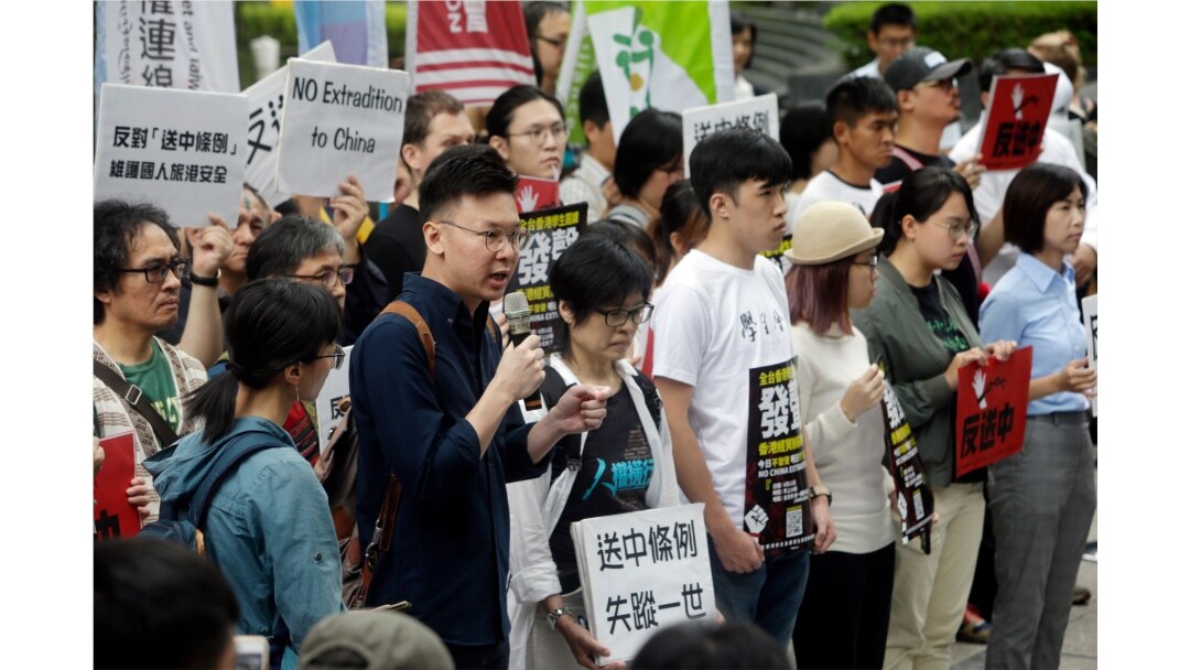 Taiwanese people gather to support Hong Kong people as the administration prepares to open debate on a highly controversial extradition law, in front of Hong Kong Economic, Trade and Culture Office in Taipei, Taiwan, June 12, 2019.
