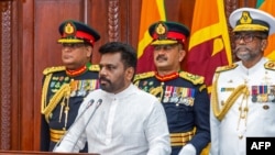 This handout photograph taken and released by the Sri Lanka President's Office on Sept. 23, 2024 shows Sri Lanka's new President Anura Kumara Dissanayake attending his swearing-in ceremony, in Colombo. 