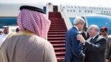 U.S. Secretary of State John Kerry (center) talks with Joseph W. Westphal, U.S. Ambassador to Saudi Arabia, before boarding his plane at King Abdulaziz International Airport in Jeddah, Sept. 12, 2014.&nbsp;