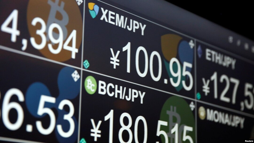 A monitor shows various cryptocurrencies' exchange rates against Japanese Yen including NEM coin (middle in the top) at 'nem bar', where customers can pay with NEM coins, in Tokyo, Japan, Jan. 29, 2018.