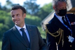 France's President Emmanuel Macron walks to a working session at the G-7 summit in Cornwall, England, June 12, 2021.