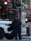 A state trooper stands by New Orleans' Canal and Bourbon streets, Jan. 2, 2025.